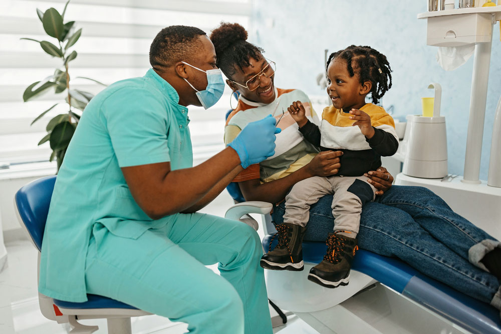 Dentist with mother and young child 
