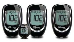 Three black True Metrix glucose meters and a small companion meter, all displaying 102 mg/dL.